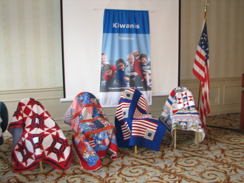 IMG_1646.JPG - A very colorful arrangement of hand sewn quilts called “Quilts Of Valor