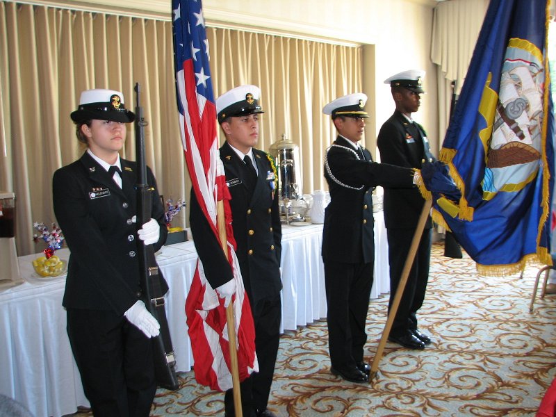 IMG_1665.JPG - The Navy Kennedy High School ROTC Presented the Colors with a crisp march into the dinner area to the complete silence of the attendees and with the colors presented, our National Anthem was sung led by the Naval Academy Brass Quintet. It was moving, as it always is.